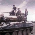 Infantrymen on Sheridan tank at Hill 43